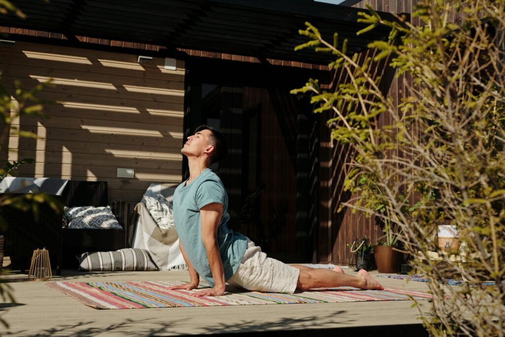 Sun Salutation yoga pose to warm up before surfing – boost flexibility and breath control.